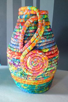 a multicolored basket sitting on top of a table