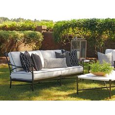 With designs highlighted by sweeping contours and graceful lines, the sofa offers a fresh interpretation of classic contemporary styling. Aluminum frames feature a sophisticated, lightly textured graphite finish, while tabletops offer an elegant contrast, with surfaces that emulate the look and feel of honed limestone. | Tommy Bahama Outdoor Pavlova Sofa Metal / Sunbrella® Fabric Included in Black / Blue / Pink | 36 H x 83 W x 36 D in | Wayfair Sofa Metal, Tommy Bahama Outdoor, Iron Patio Furniture, Outdoor Sofas, Classic Contemporary, Sunbrella Fabric, Pavlova, Tommy Bahama, Outdoor Seating