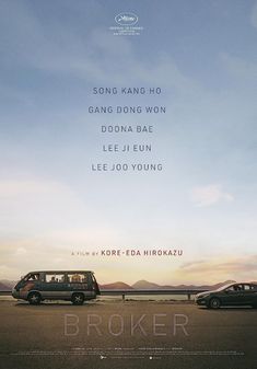 a movie poster with two cars parked on the side of the road in front of mountains