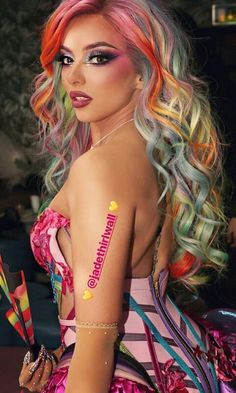 a woman with multicolored hair and makeup