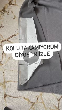 an image of a piece of clothing with the words kolu takamiyorum diyos n'zle on it