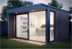 a small office in the middle of a yard with sliding glass doors on both sides