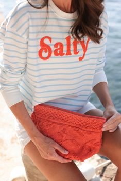 Creatures of comfort, rejoice! Shiraleah's "Salty" Sweatshirt joins our popular line of phrase-driven apparel items. Made from a lightweight cotton blend, this breathable piece is perfect for lounging at home or by the salt water. Featuring soft toothbrush embroidery and a striped design, this sweatshirt has details and colors for everyone. Pair with other items from Shiraleah to complete your look! Features a striped blue and white pattern with the word "salty" embroidered in orange letters Shiraleah is a trend-driven lifestyle brand focused on the little gifts that make life special! Made from cotton and polyester Made in China Salty Sweatshirt, Blue And White Pattern, Creatures Of Comfort, Soft Toothbrush, Crew Sweatshirts, 로고 디자인, White Pattern, Looks Style, Mode Style