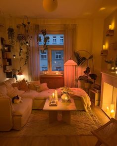 a living room filled with furniture and candles