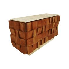 a large wooden box sitting on top of a white surface