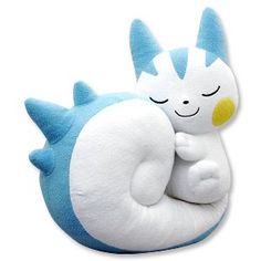 a blue and white stuffed animal sleeping on top of it's back with its eyes closed