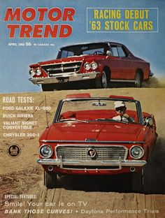 the front cover of a car magazine with two cars on it and another car in the background