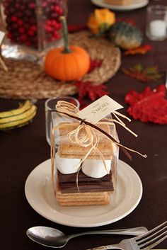 a table set with silverware, forks and napkins for thanksgiving dinner guests to enjoy