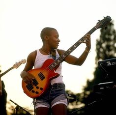 a man playing an electric guitar on stage