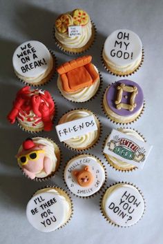there are many cupcakes with different designs on them