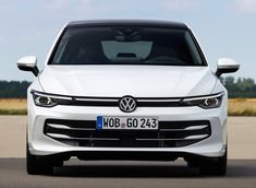 the front end of a white volkswagen car