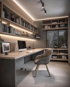 a computer desk sitting in front of a book shelf filled with books