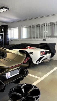 a sports car is parked in a garage
