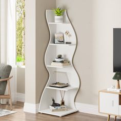 a white curved shelf in the corner of a living room