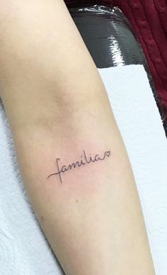 a woman's arm with the word familiar written in cursive font