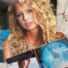 the cd cover is next to an image of a woman with blonde hair and blue eyes
