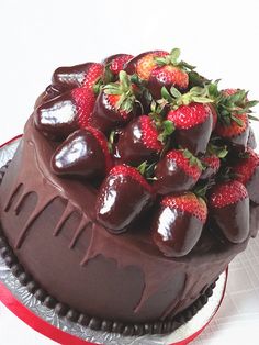 a chocolate cake with strawberries on top