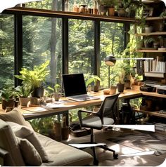 a desk with a laptop on top of it in front of a window filled with potted plants