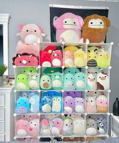 a shelf filled with lots of stuffed animals