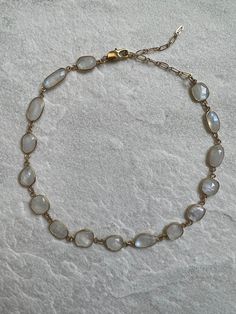 The Moonstone choker is a rare and unique. The stone is beautiful, especially in the light as it reflects light with a pearly opalescence.  The stone set in a thick 24k gold plate with a lobster claw and extension so that it can be worn as a choker or around the collar bones. The necklace itself is 12 inches with a 3 inch extension but that can be made longer upon request. Looks beautiful worn alone or layered with other pieces. The perfect gift for someone or to treat oneself. Artistic Jewelry Gold, Moonstone Beaded Necklace, Boho Gold Jewelry, Light Gold Jewelry, Crystal Jewelry Aesthetic, Crystal Necklace Aesthetic, Moonstone Choker, Jewelry With Stones, Etsy Necklace