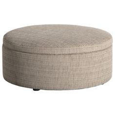 a round ottoman that is made out of fabric