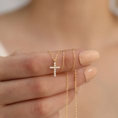 Discover the timeless elegance and spiritual significance of our 14K Solid Gold Diamond Cross Necklace. Meticulously handcrafted from the finest 14K solid gold, this necklace features a beautifully designed cross pendant, adorned with brilliant-cut diamonds that capture the light with every turn.  This necklace is perfect for various occasions, whether as a meaningful gift for religious celebrations like baptisms and confirmations or as a cherished everyday accessory. It serves not only as a piece of fine jewelry but also as a profound expression of personal beliefs and spirituality. The gold and diamonds are sourced responsibly, ensuring that each piece is not only stunning but also ethically produced. To maintain the necklace's pristine condition, store it in a dry, soft cloth bag away f Personal Beliefs, Diamond Cross Necklace Gold, Diamond Cross Necklace, Diamond Cross Necklaces, Diamond Cross, Everyday Accessories, Religious Jewelry, Lovely Jewellery, Real Diamonds