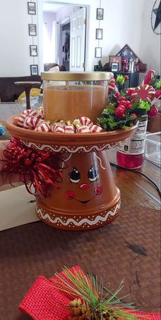 two tiered trays filled with candy canes on top of a wooden table