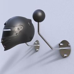 a helmet mounted to the side of a wall with a ball and hook on it