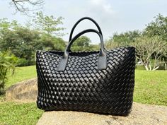 ✨This is a simple and practical woven tote bag for women. Made of high-quality Vegan leather material and fine hand-weaving, ensuring the bag's durability and exquisite appearance. ✨The woven details of this leather handbag are very delicate, and the woven part is carefully handmade, showing a unique woven texture. ✨This leather woven shoulder bag has a large internal capacity and comes with a small bag. The small bag is also woven and can be used as a cosmetic bag alone. ✨The leather woven bag Hot Bags, Daily Bag, Woven Tote Bag, Woven Texture, Leather Weaving, Basket Bag, Black Tote, Woven Bag, Handle Bag