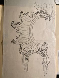 a piece of paper with an ornamental design on it