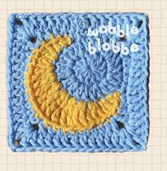 a crocheted blue and yellow square with the words bubble globe written on it