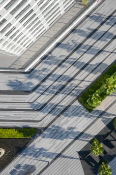 an aerial view of a street with buildings in the background