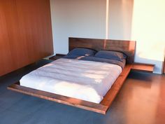 the bed is made up and ready for someone to use it in their home or office