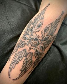 an owl tattoo is shown on the arm