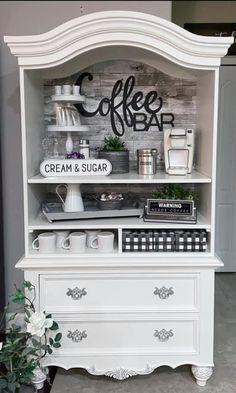 a coffee bar with cream and sugar on the top is displayed in a room that appears to be used as a display