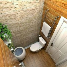 an aerial view of a bathroom with toilet and plant