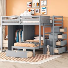 a bunk bed with stairs and drawers in a child's bedroom, next to an orange wall