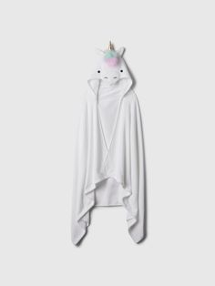 a white hoodie with a unicorn on the back and a rainbow horn at the top