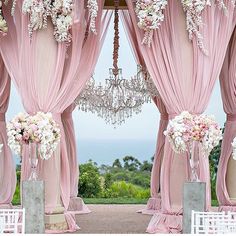 an instagram page with pink drapes and white flowers