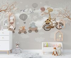 a child's room decorated in neutral tones with animals and hot air balloons on the wall