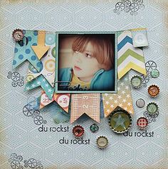 a scrapbook page with an image of a child's face in the center