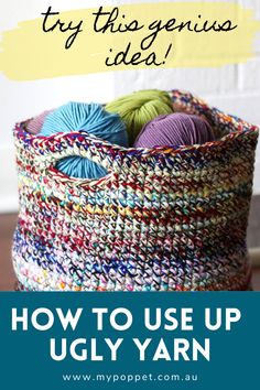 a basket filled with balls of yarn sitting on top of a wooden table