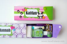 the contents of a personal care kit in a pink and green box