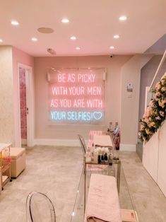 a room filled with lots of pink furniture and decor on the walls that says be as picky with your men as you are with your selfies