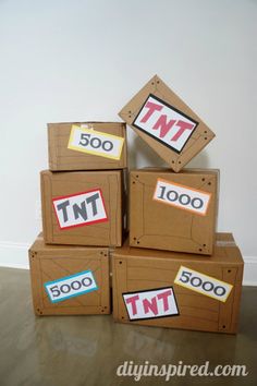 cardboard boxes stacked on top of each other with twt stickers taped to them