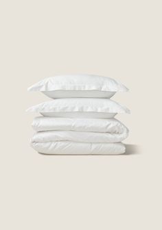 four pillows stacked on top of each other