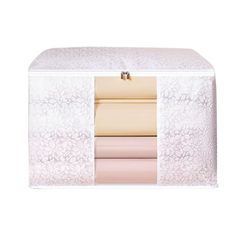 the inside of a white storage box with four different colored sheets and one pink sheet