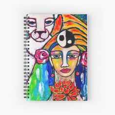 a spiral notebook with an image of a woman and two cats