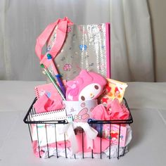 a basket filled with pink items on top of a table