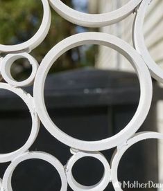 a close up view of an iron fence with circles on it